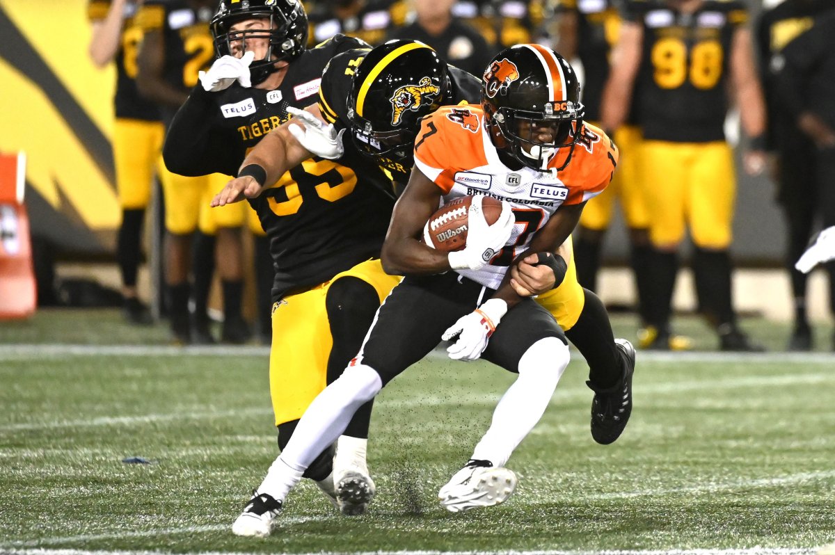 BC Lions receiver Ryan Lankford, 17, is tackled by Hamilton Tiger-Cats Aaron Crawford during second half CFL football game action in Hamilton, Ontario on Saturday, August 10, 2019. 