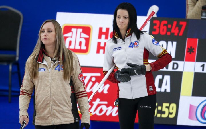 Team Ontario skip Rachel Homan, left, directs her team as Team Canada skip Kerri Einarson looks on at the Scotties Tournament of Hearts in Calgary, Alta., Thursday, Feb. 25, 2021.