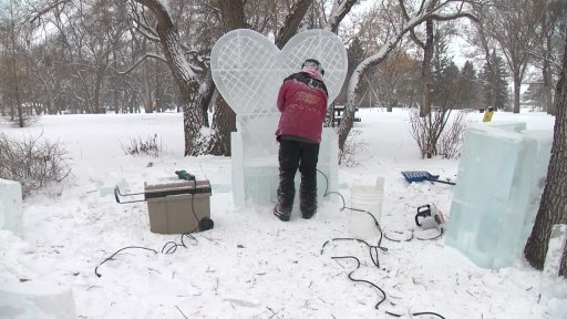 An ice carver working inside Borden Park
