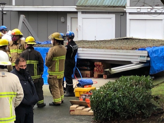 Delivery man dead after unattended truck collapses a carport - image