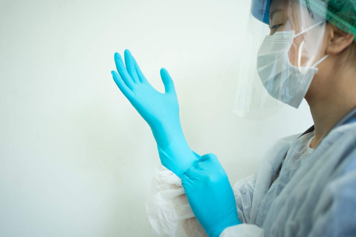 Female doctor teaching How to wearing Surgical mask for protect Covid-19 (coronavirus) and pm 2.5 air pollution.