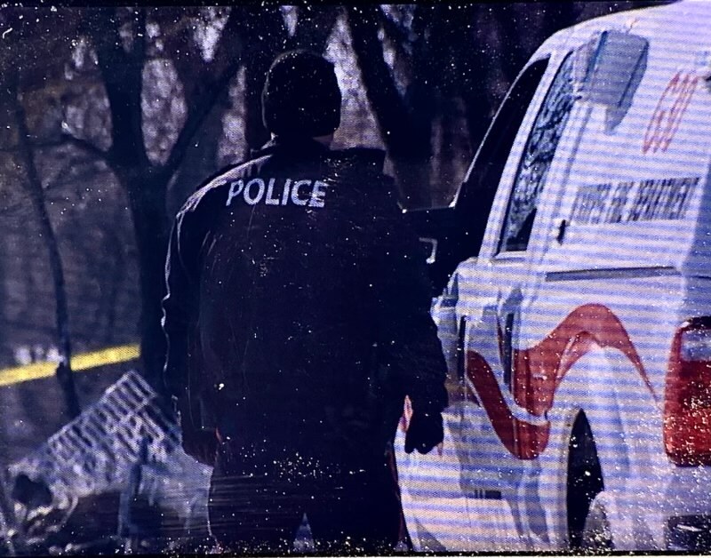 Police and first responders at the scene of the aftermath of a homeless camp fire in Winnipeg on Tuesday, Feb. 16.