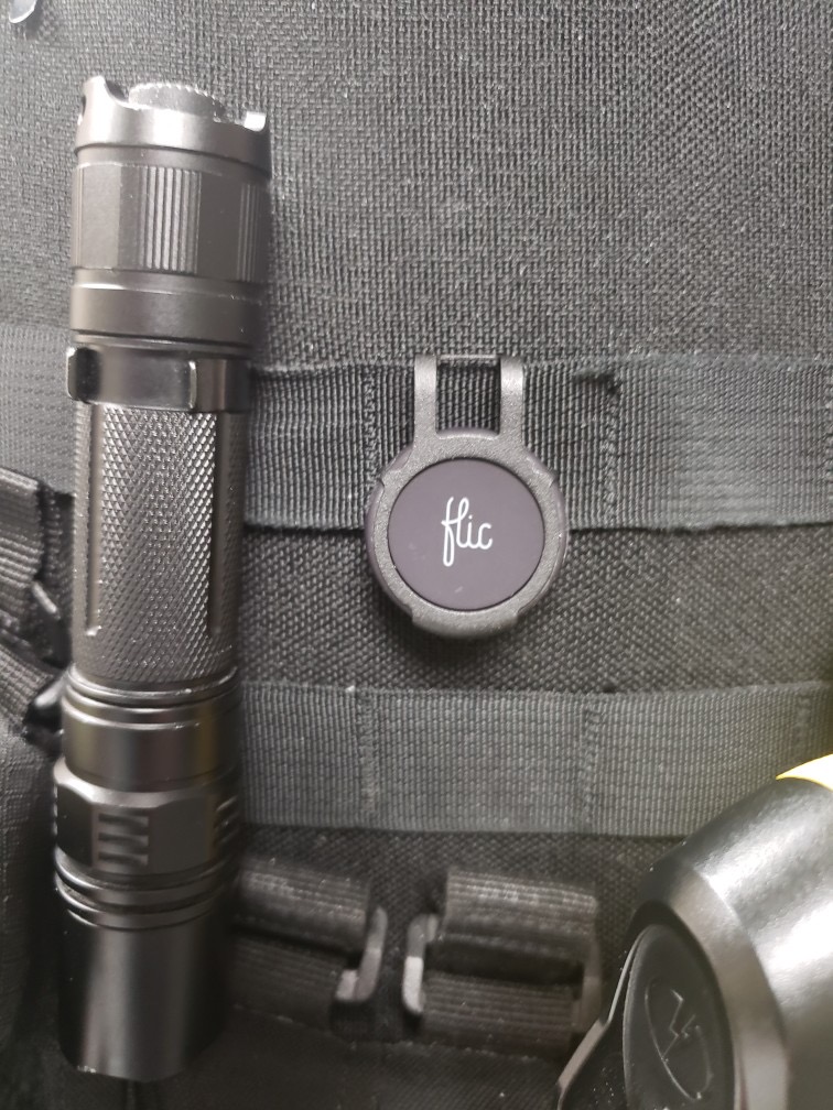 Altona police officer wearing button that enables app to start recording through their cell phone.