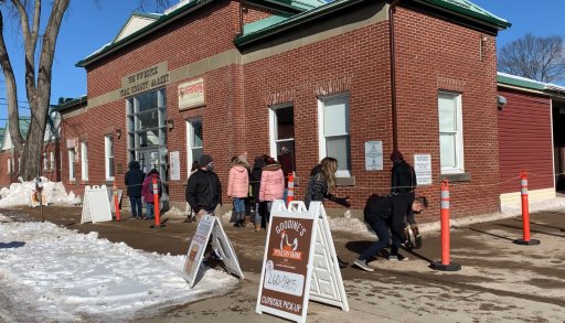 On a sunny cold Saturday morning locals line up outside the Fredericton Boyce Farmers Market.