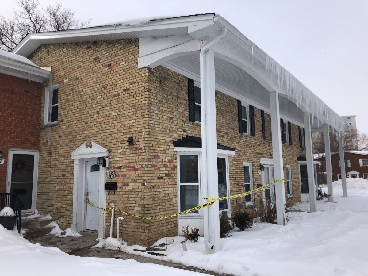 Caution tape at a residence on Arbour Glen Crescent on Feb. 18, 2021.