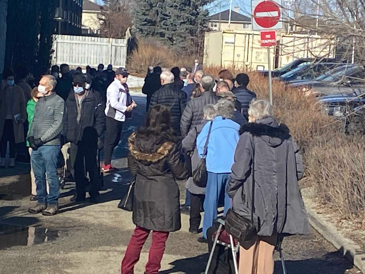 Seniors were greeted with long lines and lengthy waits on Day 2 of Phase 2A of Alberta's COVID-19 vaccine plan on Feb. 25, 2021.