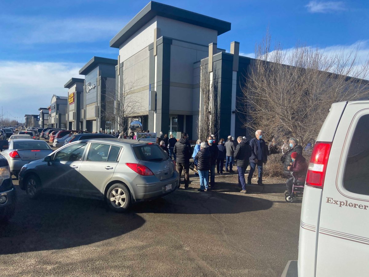 People and vehicles filled the parking lot on Day 1 of seniors 75 and older eligibility for the COVID-19 vaccine on Feb. 25, 2021.