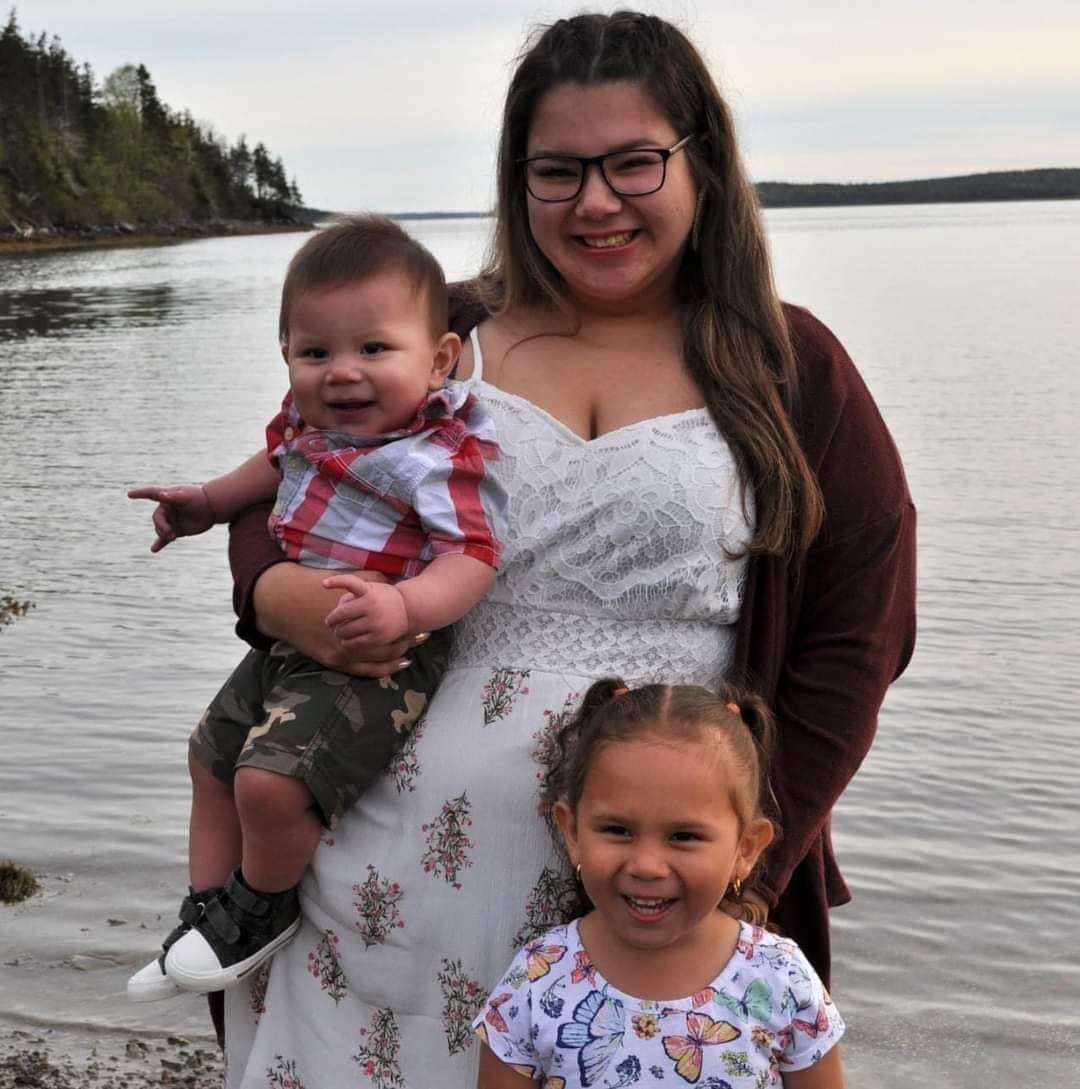 Jeneva Dennis is seen with her two children.