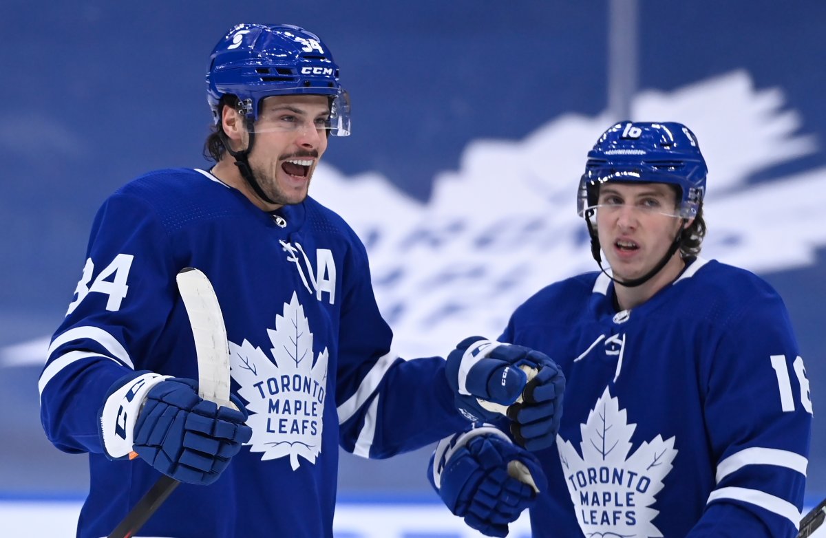 Toronto Maple Leafs centre Auston Matthews (34) celebrates his power play goal against the Ottawa Senators with teammate Mitch Marner (16) during an NHL game in Toronto on Thursday, February 18, 2021.