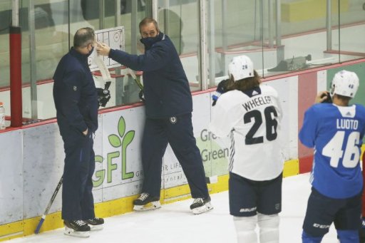 Winnipeg Jets assistant coach Dave Lowry, left, and head coach Paul Maurice talk to their team during the first day of their NHL training camp in Winnipeg, Monday, Jan. 4, 2021.