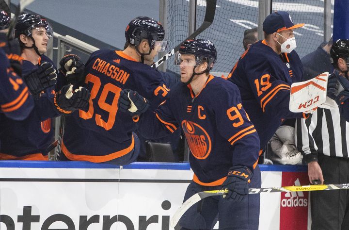 Edmonton Oilers’ Connor McDavid (97) celebrates his 500th career point against the Winnipeg Jets during first period NHL action in Edmonton on Wednesday, February 17, 2021.