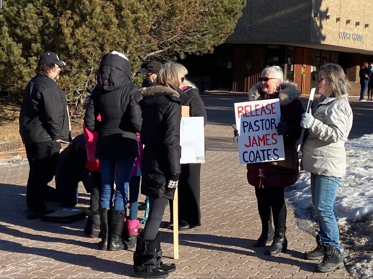 Supporters gather outside the courthouse in Stony Plain for pastor James Coates Wednesday, Feb. 24, 2021.