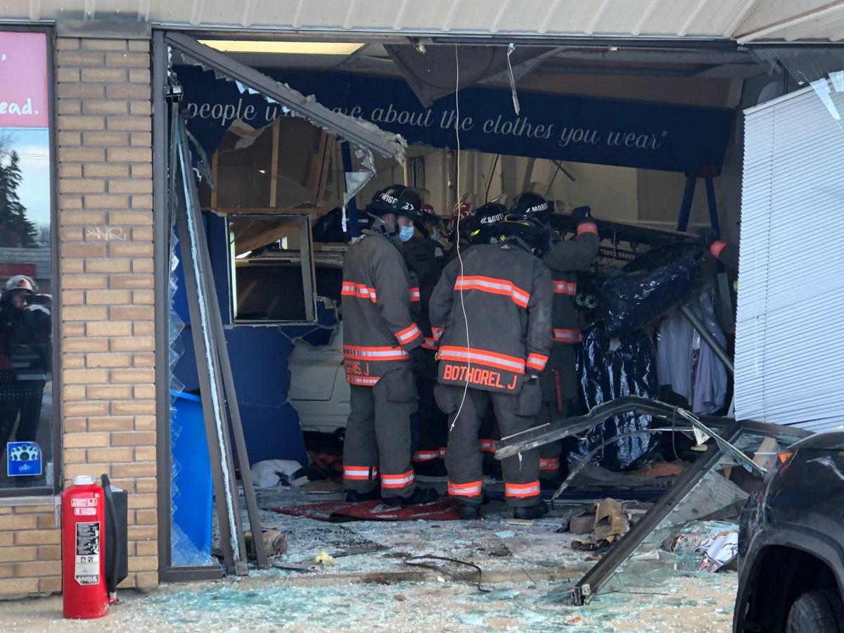 Saskatoon police say a woman who was a customer in a store suffered life-threatening injuries after a minivan drove into the building.