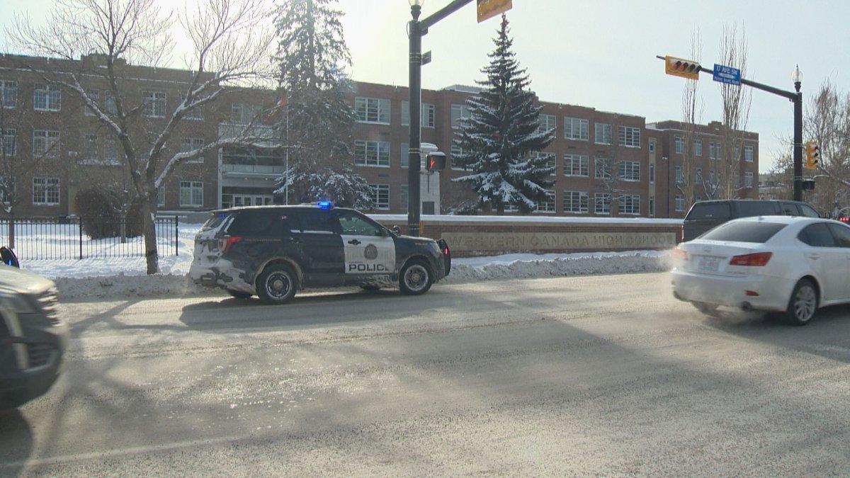 Calgary police officers outside Western Canada High School after several reports of a gun at the school were called in. 