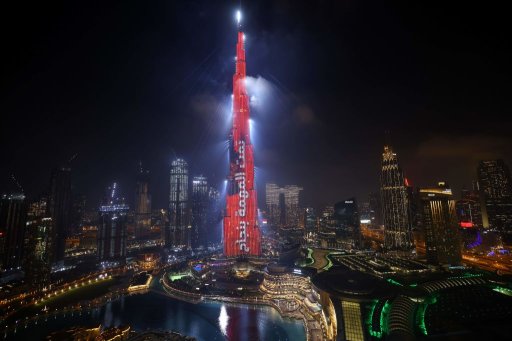 Dubai’s Burj Khalifa is lit up in red with a slogan reading in Arabic, “Mission accomplished” on Feb. 9, 2021, as the UAE’s ‘Al-Amal’ — Arabic for ‘Hope’ — probe successfully entered Mars’ orbit, making history as the Arab world’s first interplanetary mission.