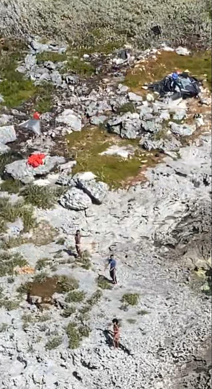 Three Cuban nationals are showing during a U.S. Coast Guard rescue on a deserted island on Feb. 8, 2021.