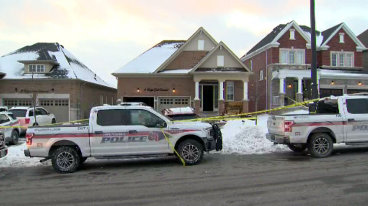 Police outside of a home on Ridge Gate Crescent.