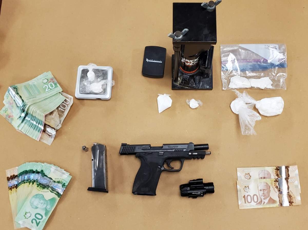 Police say a 24-year-old and a 27-year-old, both from London, are facing drug and weapon related charges.