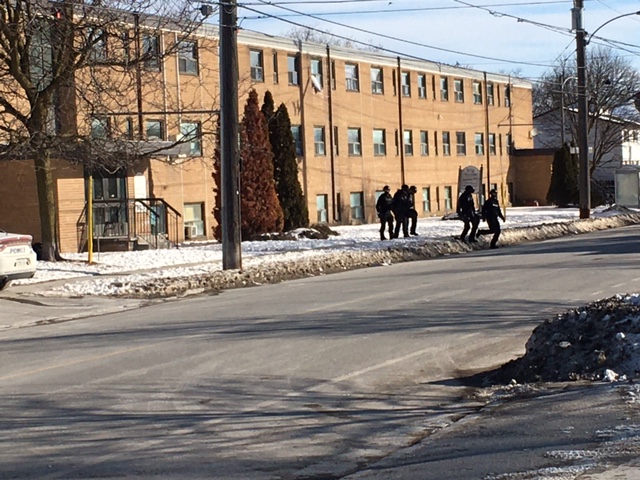 Members of the Peterborough emergency response team outside TVM Manor on McDonnel St. on Wednesday morning.