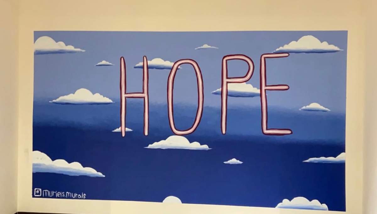 Muriel Charlebois, 14, painted a HOPE mural at the COVID-19 testing site at Calgary's old Greyhound bus station.
