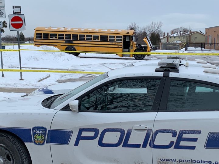 Police at the scene where a body was found inside of a bus in Brampton on Saturday.