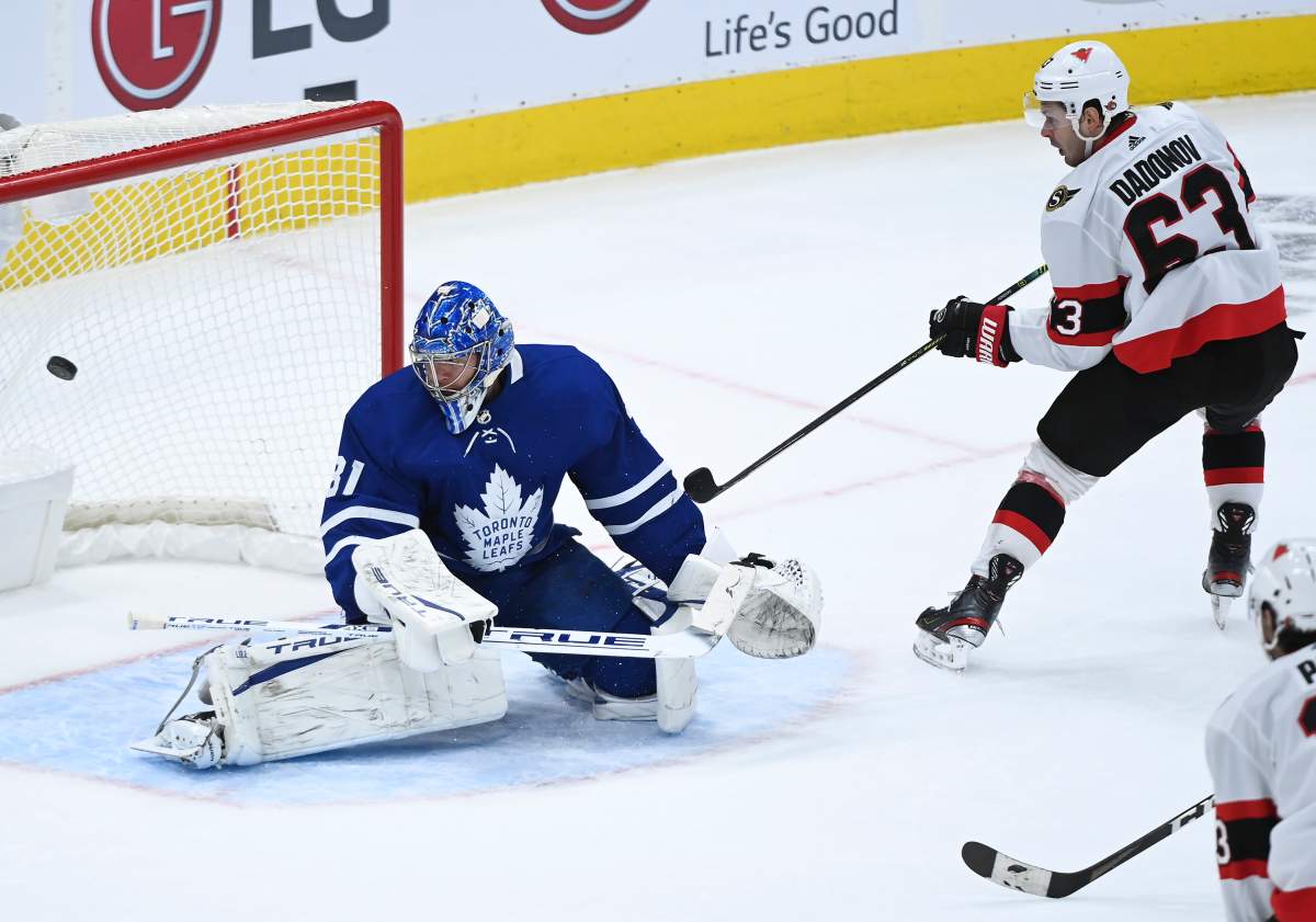 Ottawa Senators right wing Evgenii Dadonov (63) scores the game winning goal past Toronto Maple Leafs goaltender Frederik Andersen (31) during overtime NHL hockey action in Toronto on Monday, February 15, 2021.