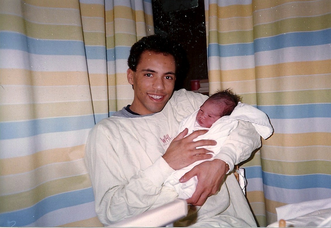 Tim Hague with his newborn in 1989.