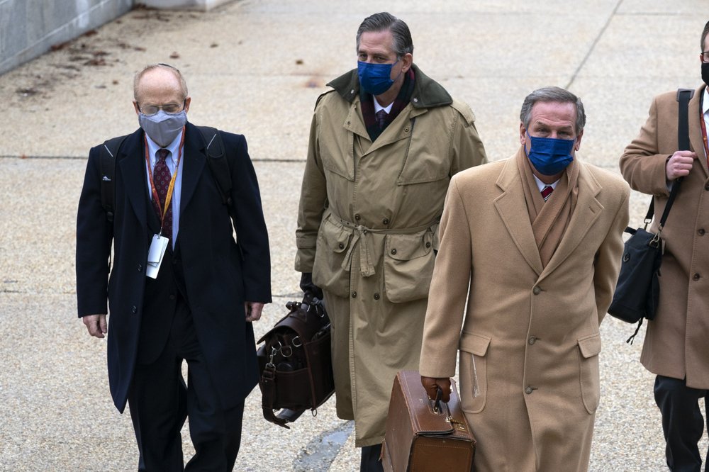 From left, David Schoen, Bruce Castor and Michael van der Veen, lawyers for former President Donald Trump, arrive at the Capitol on the third day of the second impeachment trial of Trump in the Senate, Thursday, Feb. 11, 2021, in Washington.