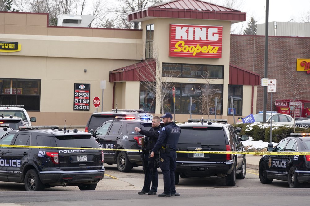 Police work on the scene outside of a King Soopers grocery store where a shooting took place Monday, March 22, 2021, in Boulder, Colo.