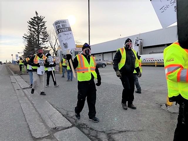 Members of Teamsters Local Union 987 of Alberta at the Coca-Cola plant in northeast Calgary walked off the job on Monday, March 15, 2021.