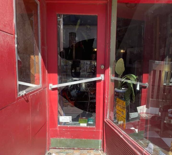 The damaged entrance to Mystic Bookshop in London, Ont.