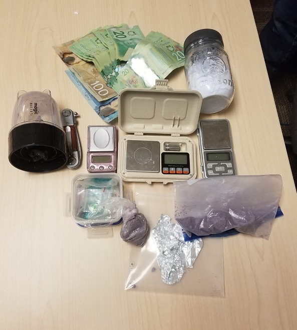 Kingston police charge two people with possession for the purpose of trafficking after they find $40,000 worth of fentanyl, cash, and drug paraphernalia.