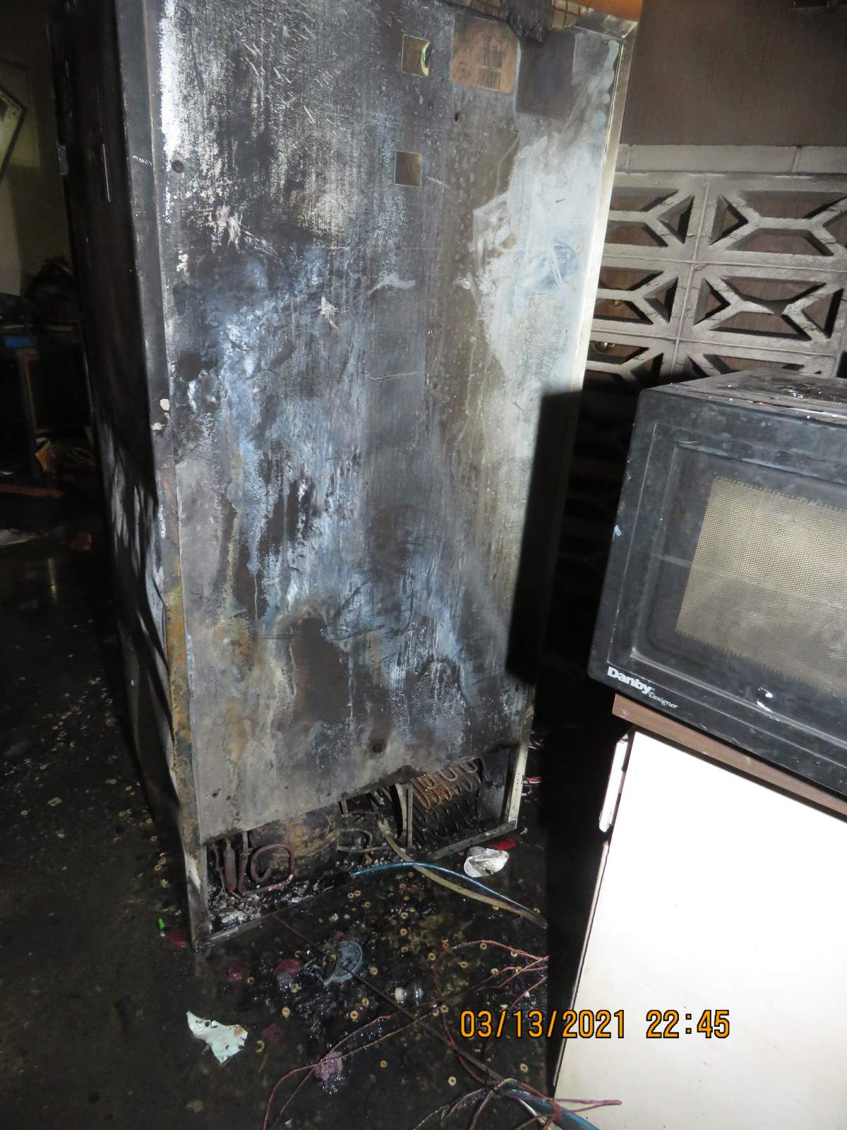 The cause of the fire was determined to be accidental and originated from behind the fridge in a kitchen in a ground floor suite.