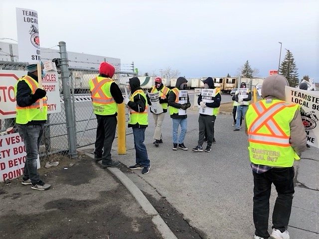 Members of Teamsters Local Union 987 of Alberta at the Coca-Cola plant in northeast Calgary walked off the job on Monday, March 15, 2021.
