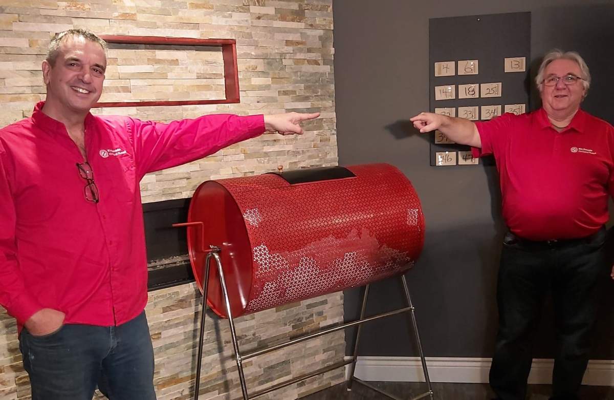 Left to right: Doug Anthony, vice-president and founder of the Kin Club of Russell, and Bill McInnis, the 'godfather' of the club's catch-the-ace committee, prepare for a recent draw.