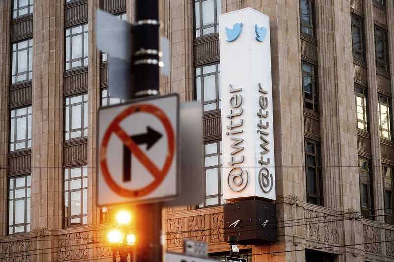 FILE - In this Jan. 11, 2021, file photo, a sign hangs at Twitter headquarters in San Francisco. Republican state lawmakers are pushing for social media giants to face costly lawsuits for policing content on their websites, taking aim at a federal law that prevents internet companies, like Twitter, from being sued for removing posts.