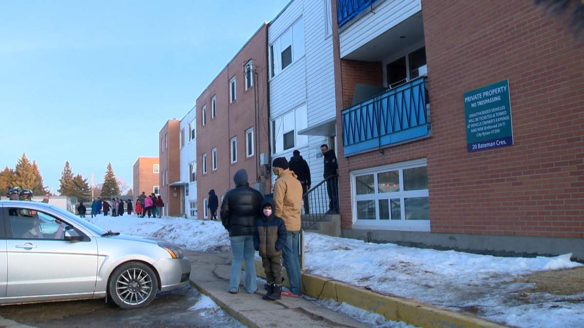Residents of a Saskatoon apartment stand outside after being evacuated for the second time in two months due to dangerous carbon monoxide levels.