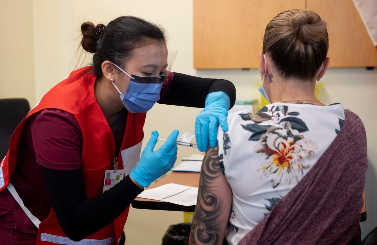Nurse Venus Lucero administered the first Pfizer-BioNTech COVID-19 vaccine at the Ottawa Hospital to Jo-Anne Miner Tuesday December 15, 2020. Hospital CEO Cameron Love said it was the most "memorable day" of the COVID-19 pandemic.