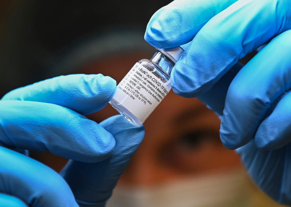A health-care worker prepares a dose of the Pfizer-BioNTech COVID-19 vaccine at a UHN COVID-19 vaccine clinic in Toronto on Thursday, January 7, 2021.