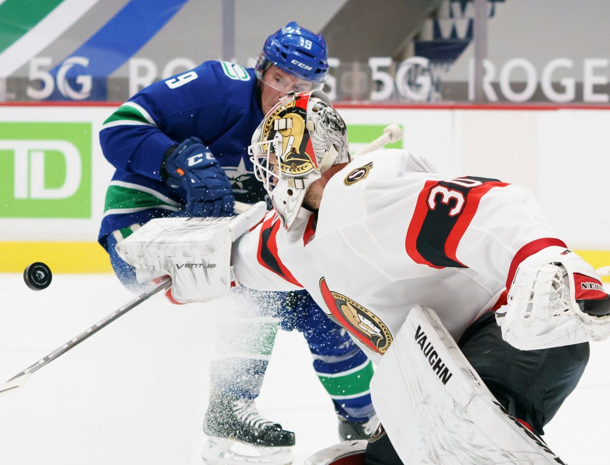 Ottawa Senators goaltender Matt Murray (30) stops a shot from Vancouver Canucks centre J.T. Miller (9) during second period NHL action in Vancouver, Thursday, January 28, 2021. Murray's status is unknown as the Canucks head into Ottawa Monday night. 