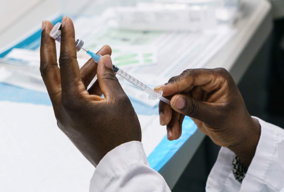 A dose of COVID-19 vaccine is prepared at a vaccination clinic in Montreal's Olympic Stadium on Tuesday, February 23, 2021. 