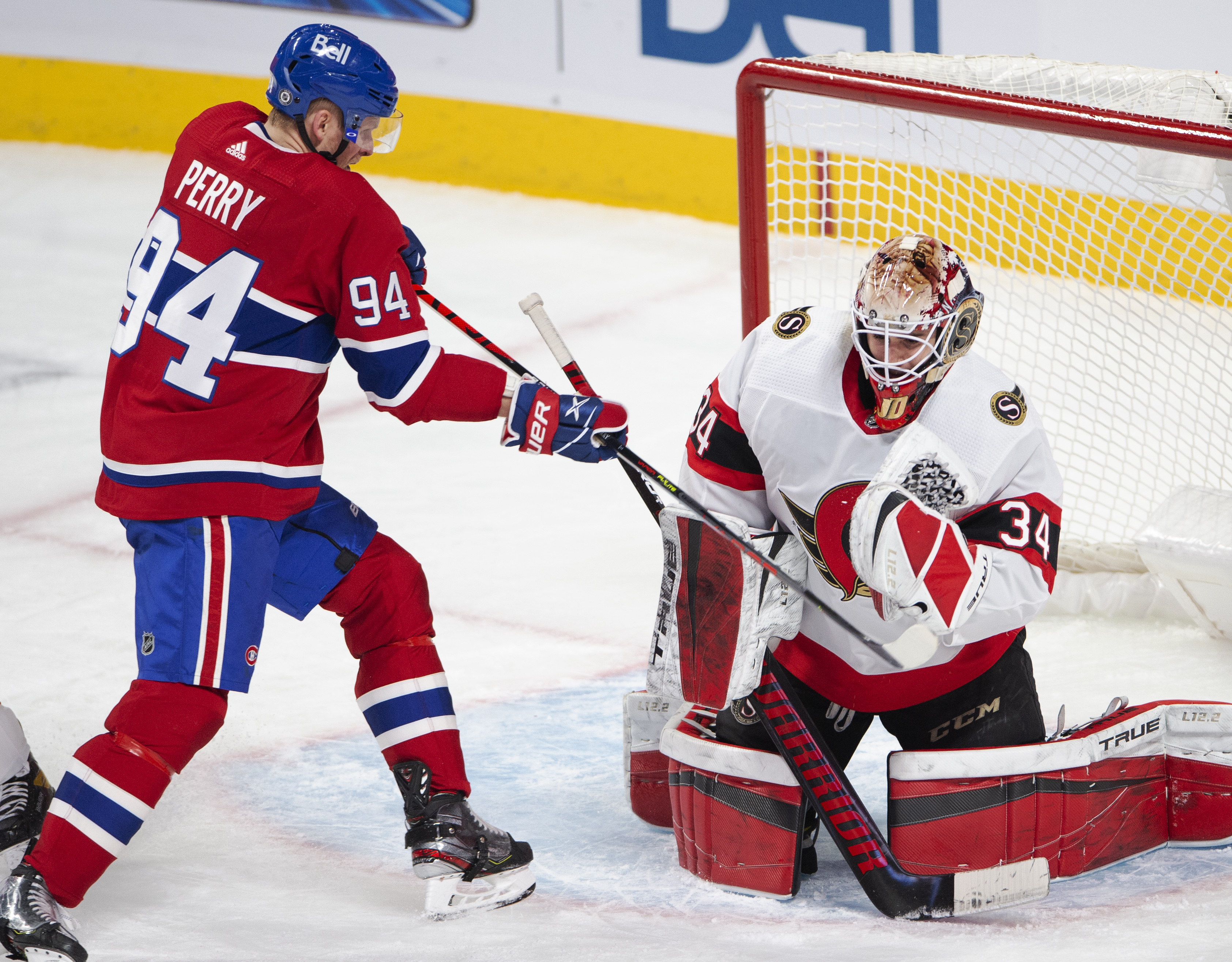 The puck comes out of Ottawa Senators goaltender Joey Daccord's