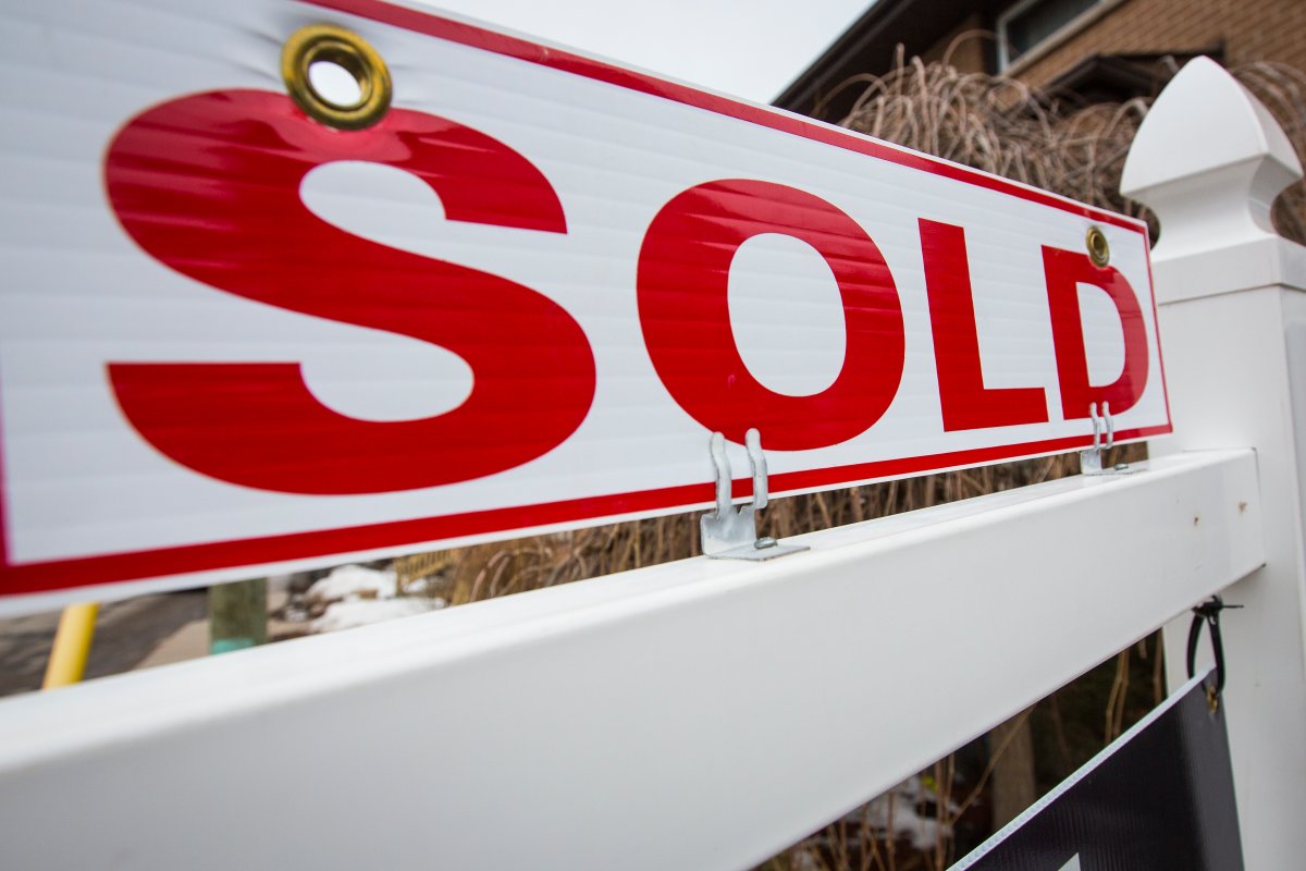 A real estate sold sign on a property in Kingston, Ontario on Wednesday, March 3, 2021.
