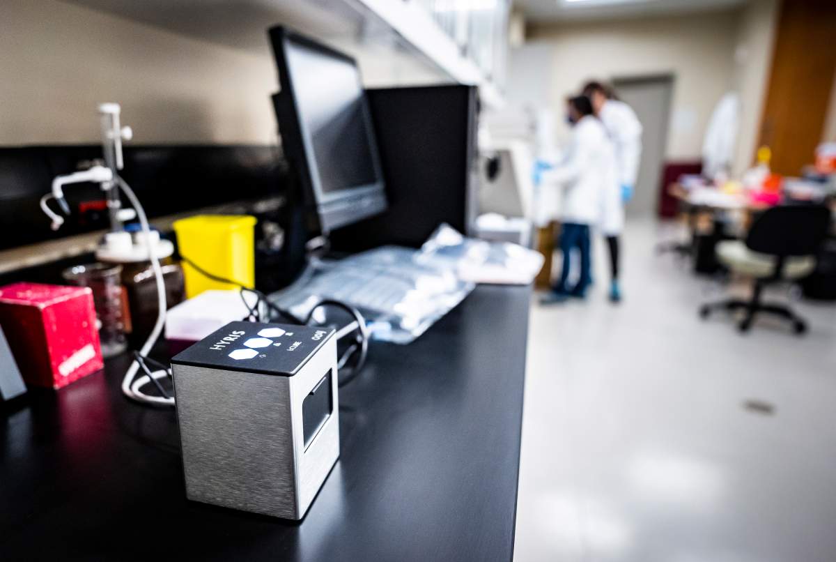 The Hyris Bcube unit is shown as Lab techs Mandy Chan and Maura Hooper work with the first swab samples to be tested for COVID-19 at the Canadian Sport Institute Calgary biochemistry lab in Calgary on January 15, 2020. 