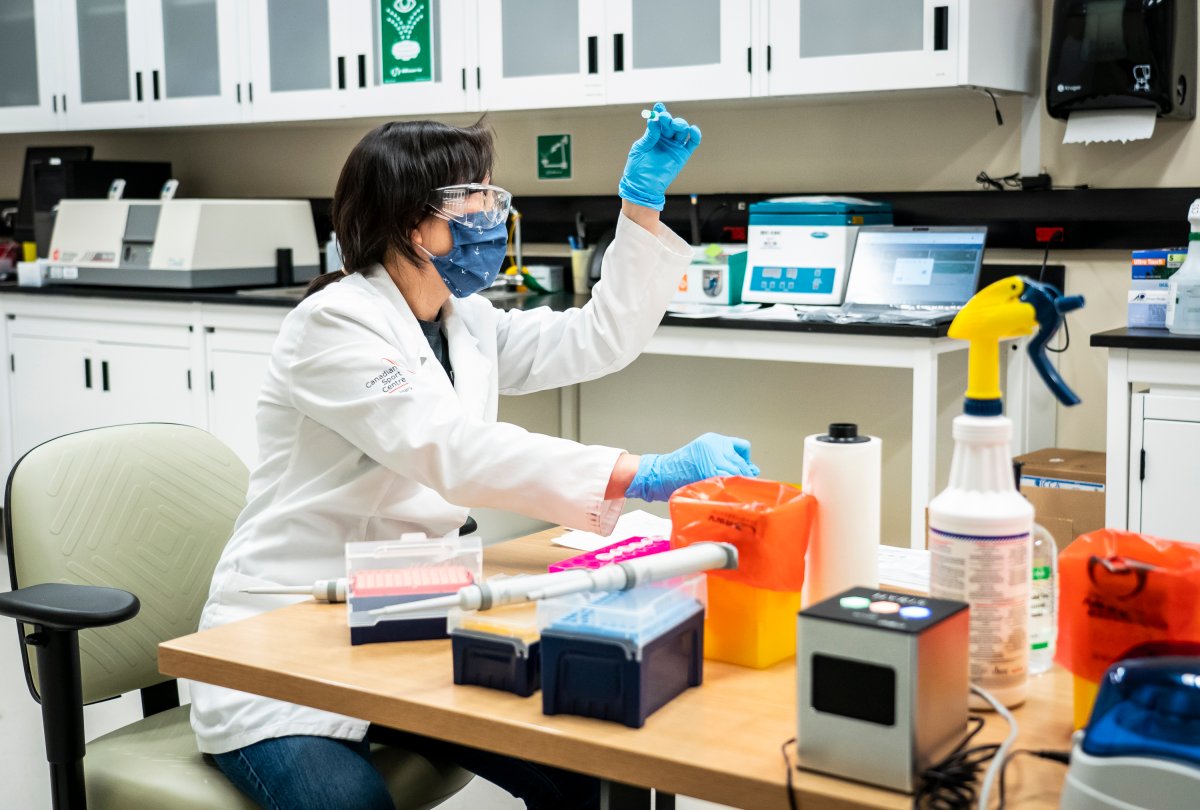 Biochemist Mandy Chan works with the first swab samples to be tested for COVID-19 at the Canadian Sport Institute Calgary biochemistry lab in Calgary on January 15, 2020.