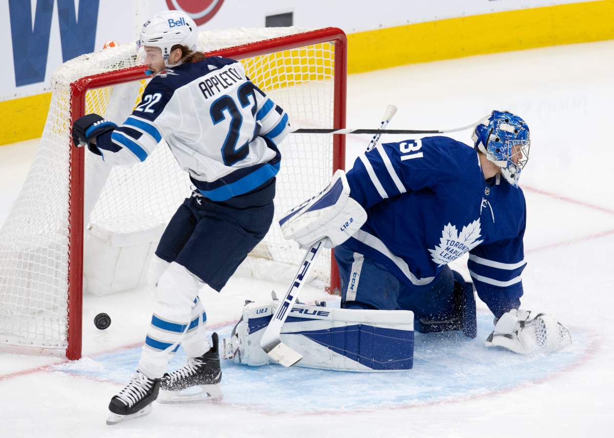 Winnipeg Jets centre Mason Appleton (22) scores on Toronto Maple Leafs goaltender Frederik Andersen (31) during second period NHL action in Toronto on Saturday, March 13, 2021.