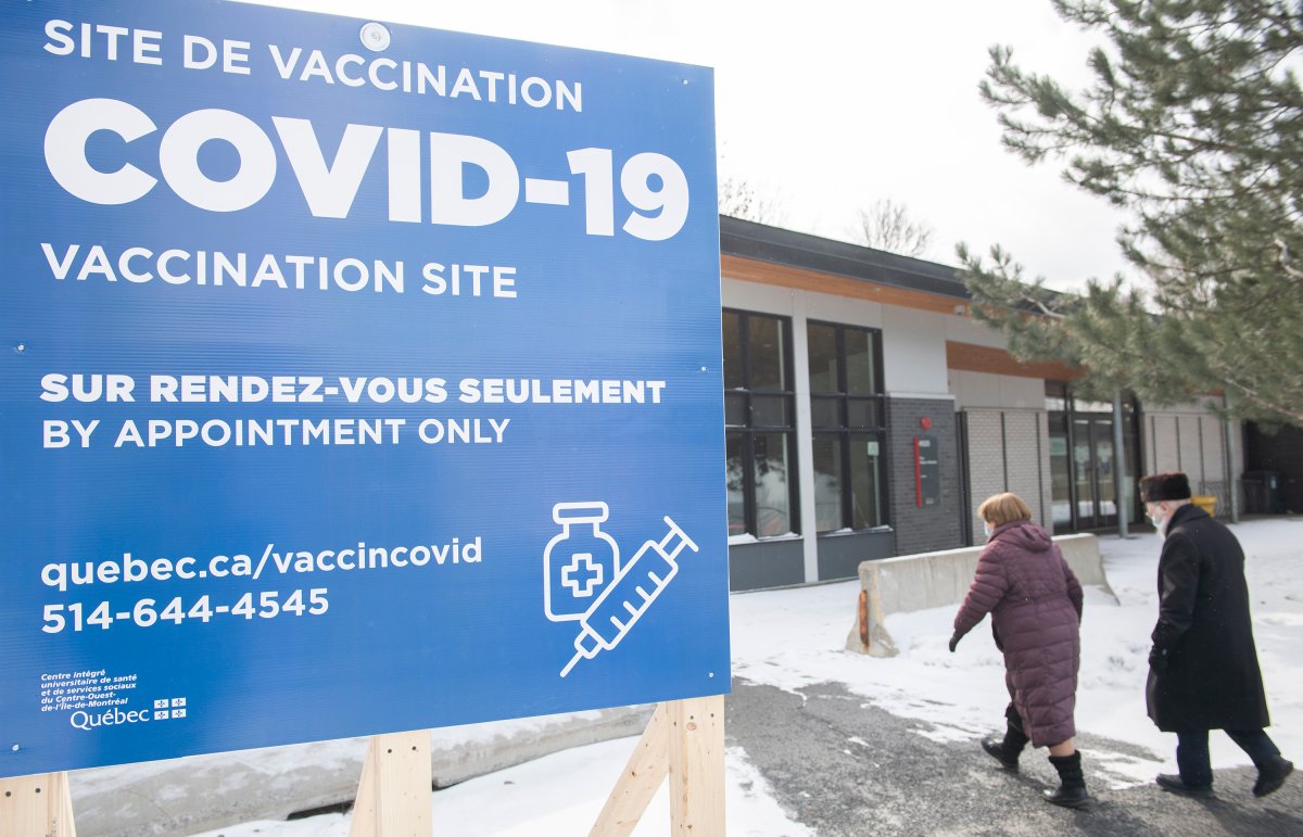 People are shown at a COVID-19 vaccination site in Montreal, Sunday, March 14, 2021, as the COVID-19 pandemic continues in Canada and around the world. 