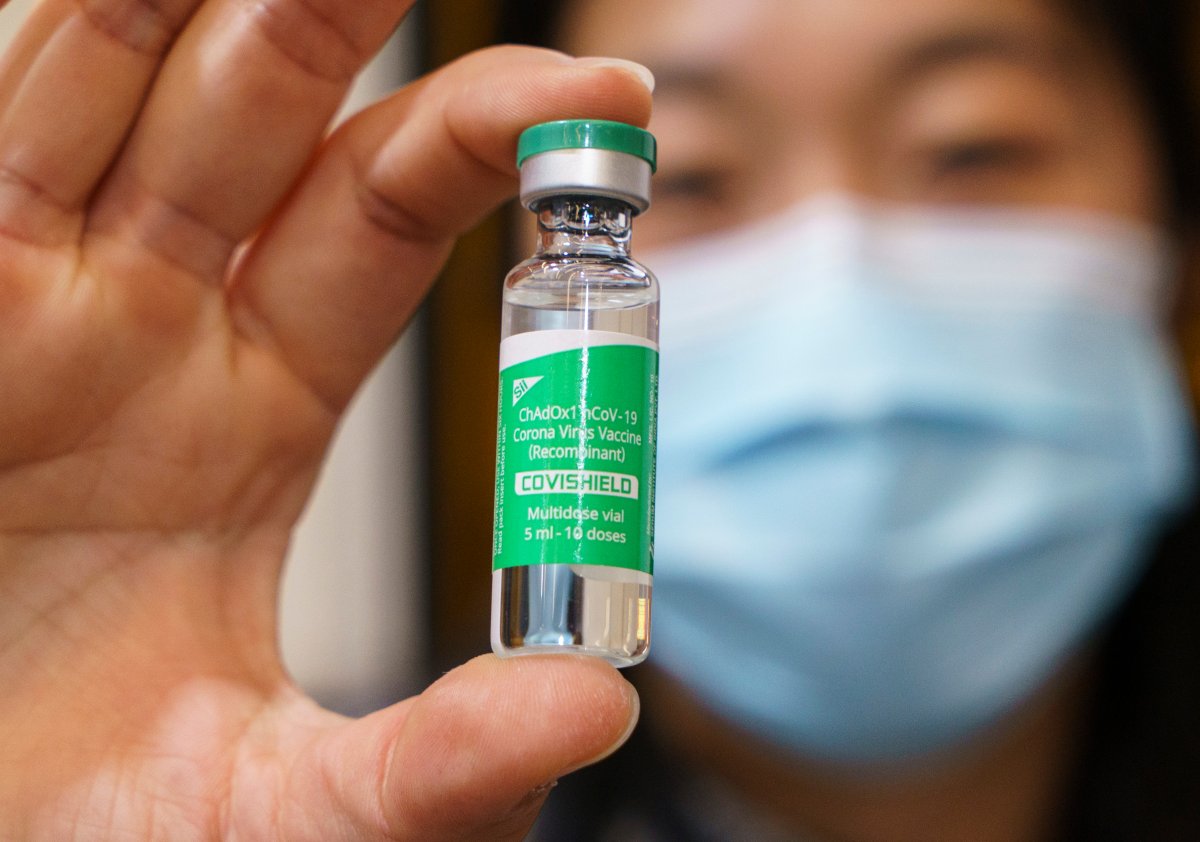 A healthcare worker holds up a vial of the AstraZeneca Covishield vaccine at a COVID-19 vaccination clinic in Montreal, Thursday, March 18, 2021. 