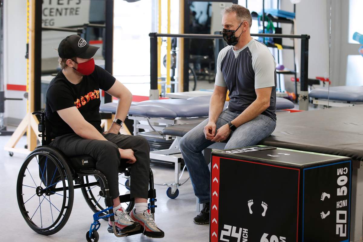 Ketler talks with his dad Trevor during a break from a physiotherapy session.