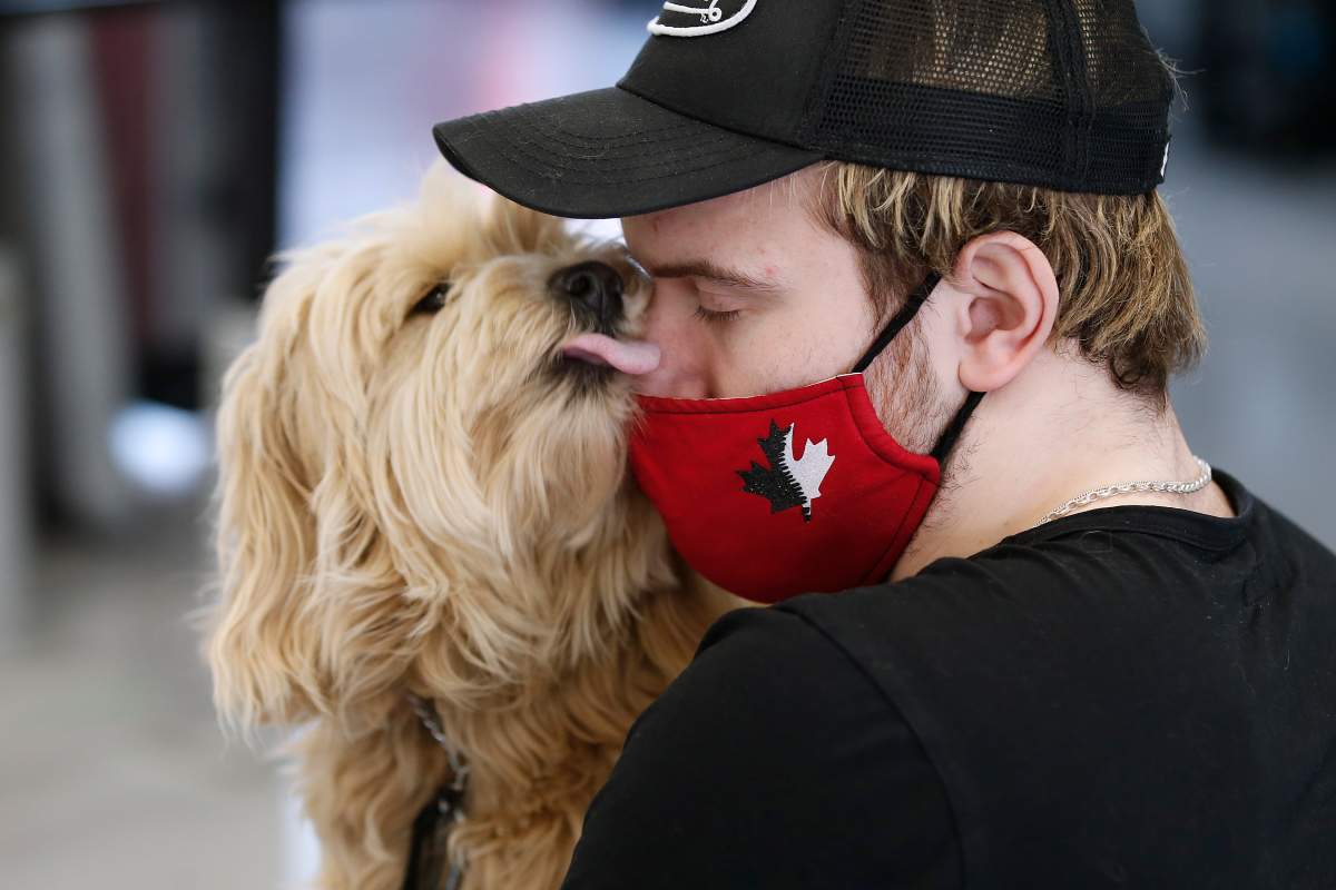 Ketler gets a kiss from his puppy, Daisy.